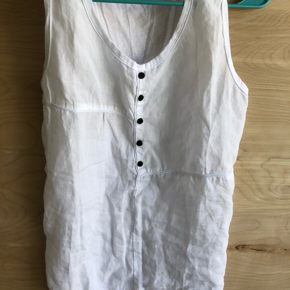 White sleeveless top.